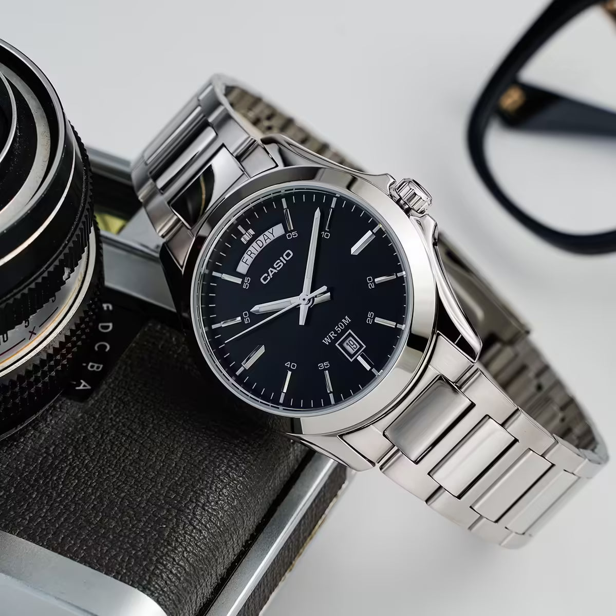Casio MTP-1370D-1A1VDF men's watch featuring a sleek black analog dial and polished stainless steel link bracelet