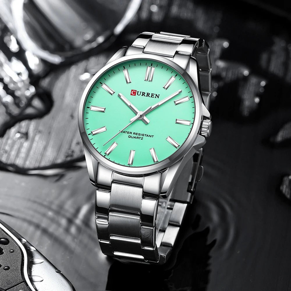Curren C-9090G men's watch featuring a vibrant sea green analog dial and polished silver stainless steel link bracelet