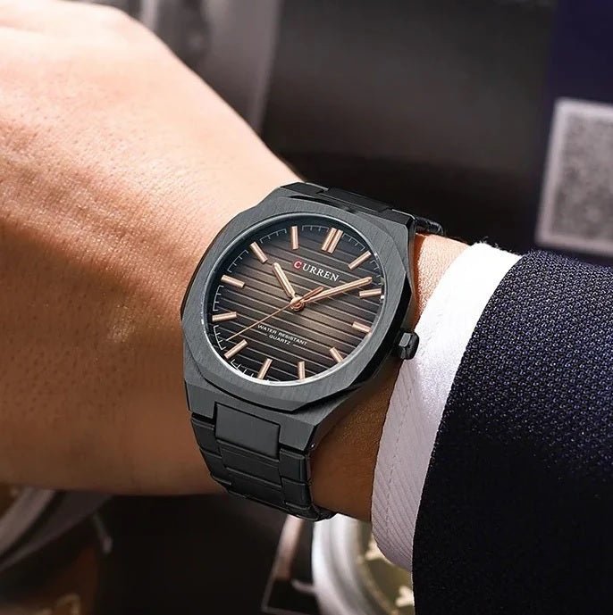 Curren M-8456 men's watch featuring a sleek black analog dial and matching durable black stainless steel link bracelet