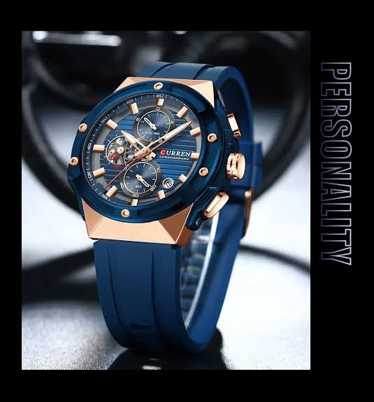 Curren M-8462 men's watch featuring a vibrant blue chronograph dial, striking gold case, and comfortable blue rubber strap