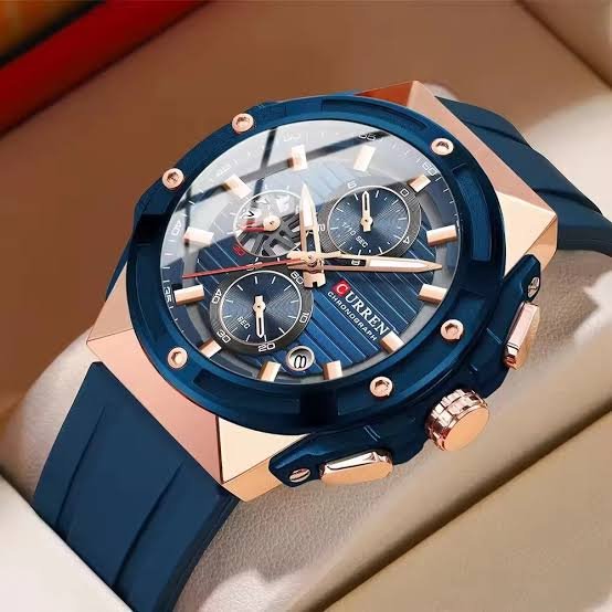 Curren M-8462 men's watch featuring a vibrant blue chronograph dial, striking gold case, and comfortable blue rubber strap
