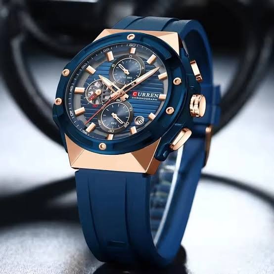Curren M-8462 men's watch featuring a vibrant blue chronograph dial, striking gold case, and comfortable blue rubber strap