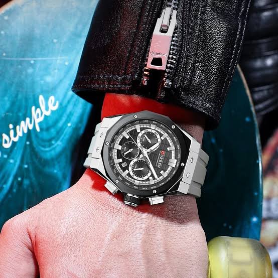 Curren M-8464 men's watch featuring a bold black chronograph dial, sleek silver case, and comfortable gray rubber strap