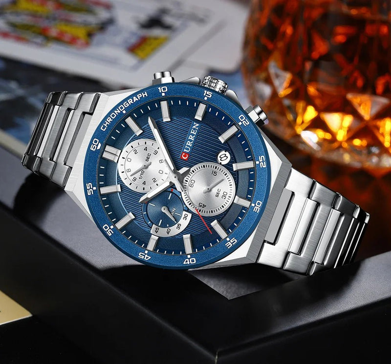 Curren M8325 men's chronograph watch featuring a striking blue dial face and polished silver stainless steel link bracelet