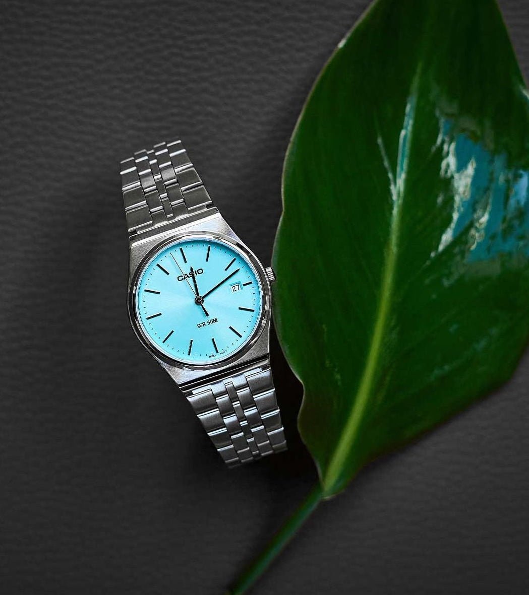 Casio MTP-B145G-9AVEF men's watch featuring a trendy Tifny blue analog dial and luxurious gold stainless steel link bracelet