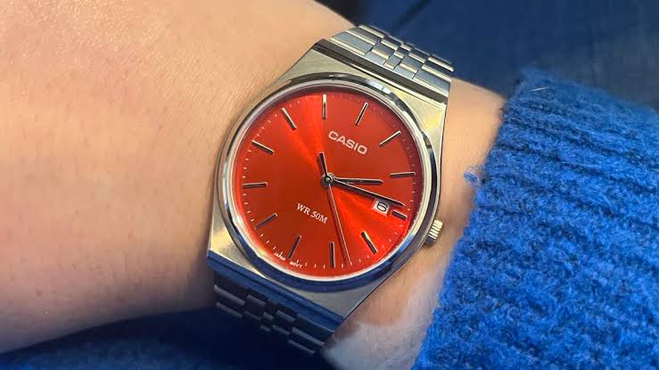 Casio MTP-B145D-4A2 men's watch featuring a bold red analog dial and elegant silver stainless steel link bracelet