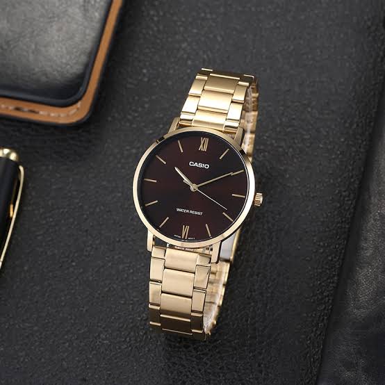 Casio MTP-VT01G-5BUDF men's watch featuring a rich brown analog dial and polished stainless steel bracelet